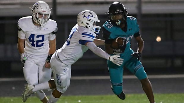 Gulf Coast Sharks running back Javien Altine (20) rushed for 322 yards against the Barron Collier Cougars on Oct. 4, 2024.