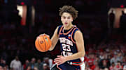 Dec 9, 2025; Columbus, Ohio, USA; Illinois Fighting Illini guard Andrej Stojakovic (2) brings the ball up court as Ohio State Buckeyes guard John Mobley Jr. (0) defends during the first half Value City Arena. Mandatory Credit: Joseph Maiorana-Imagn Images