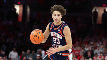 Dec 9, 2025; Columbus, Ohio, USA; Illinois Fighting Illini guard Andrej Stojakovic (2) brings the ball up court as Ohio State Buckeyes guard John Mobley Jr. (0) defends during the first half Value City Arena. Mandatory Credit: Joseph Maiorana-Imagn Images