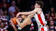 Arizona Wildcats guard Anthony Dell’Orso (3) reaches over Colorado Buffaloes center Elijah Malone (50) to attempt to take the ball during the second half at McKale Center. 
