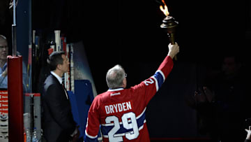 Oct 16, 2014; Montreal, Quebec, CAN; Canadiens former goalie Ken Dryden brings the torch before the game between the Boston Bruins and the Montreal Canadiens at the Bell Centre. Mandatory Credit: Eric Bolte-Imagn Images