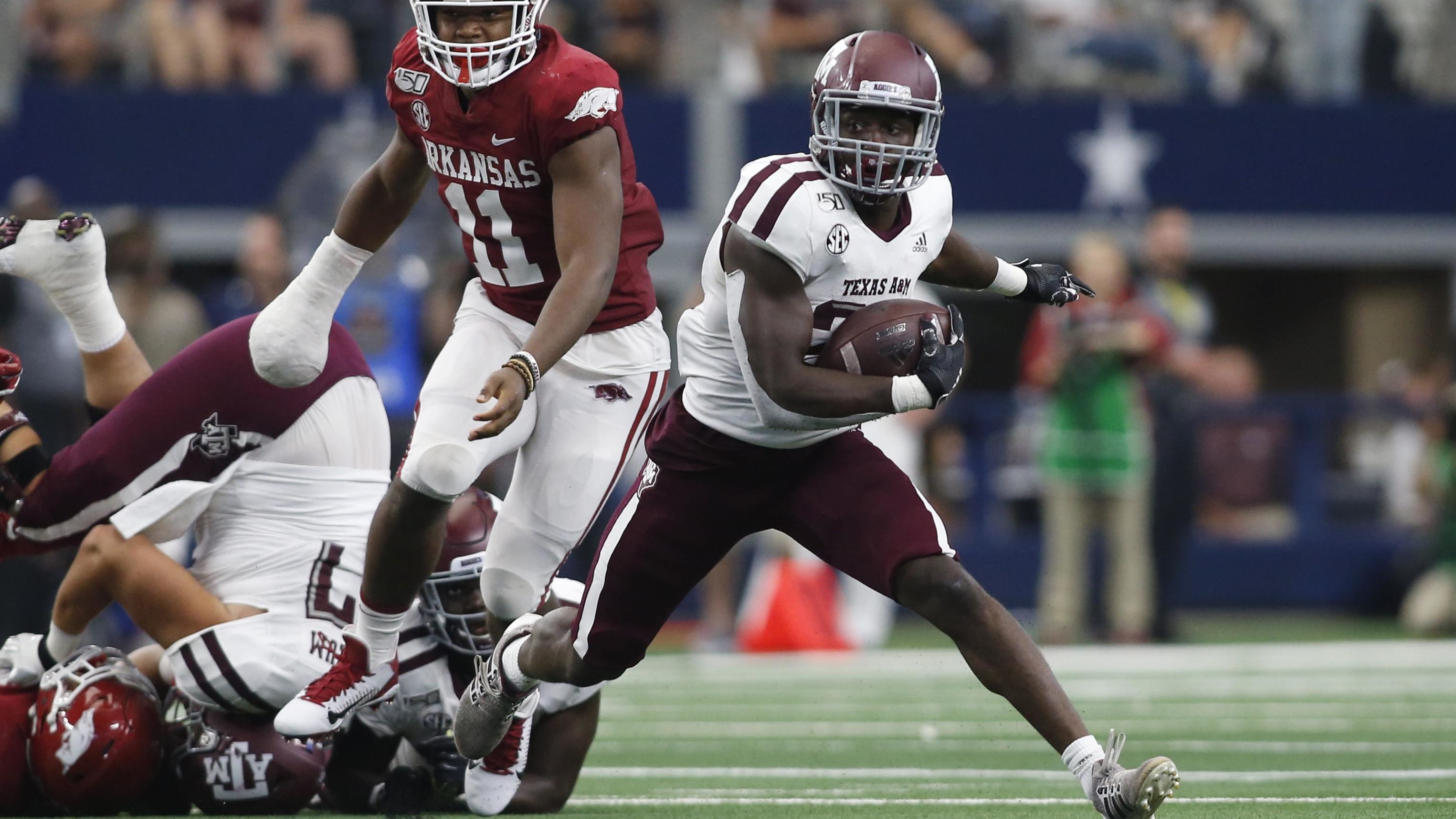 Texas A&M Aggies running back Jacob Kibodi (23) runs the ball against Arkansas.