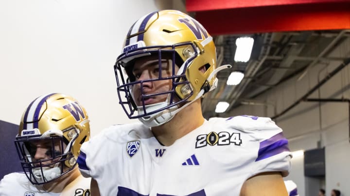 Jan 8, 2024; Houston, TX, USA; Washington Huskies offensive lineman Julius Buelow (77) against the Michigan Wolverines during the 2024 College Football Playoff national championship game at NRG Stadium. Mandatory Credit: Mark J. Rebilas-USA TODAY Sports