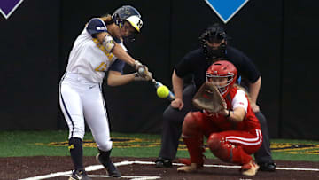 Michigan’s Jenissa Conway (13) swings at a pitch during the Big Ten softball tournament Friday, May 10, 2024 in Iowa City, Iowa.