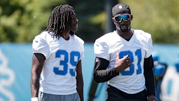 Detroit Lions cornerback Morice Norris (39) talks to safety Kerby Joseph (31) after practice during OTAs at Detroit Lions headquarters and training facility in Allen Park on Thursday, May 30, 2024.