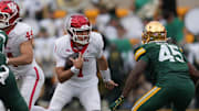 Houston Cougars quarterback Conner Weigman carries the ball against Baylor Bears linebacker Kyland Reed during the second half at McLane Stadium. 
