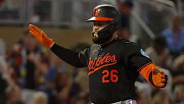 Sep 28, 2024; Minneapolis, Minnesota, USA; Baltimore Orioles third baseman Emmanuel Rivera (26) celebrates his solo home run against the Minnesota Twins in the fifth inning at Target Field. Mandatory Credit: Bruce Kluckhohn-Imagn Images
