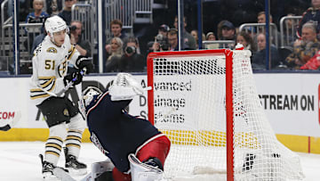 Nov 27, 2023; Columbus, Ohio, USA; Boston Bruins center Matthew Poitras (51) scores a goal on his shot past Columbus Blue Jackets goalie Spencer Martin (30) during the third period at Nationwide Arena. Mandatory Credit: Russell LaBounty-USA TODAY Sports