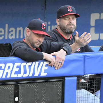 Jul 22, 2025; Cleveland, Ohio, USA; Cleveland Guardians associate manager Craig Albernaz (left), manager Stephen Vogt (center) and pitching coach Carl Willis (51) react after a foul ball entered the dugout in the third inning against the Baltimore Orioles at Progressive Field. Mandatory Credit: David Richard-Imagn Images