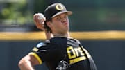 Oregon’s Grayson Grinsell pitches against Cal Poly during the first inning of an elimination game in the Eugene NCAA Regional at PK Park.