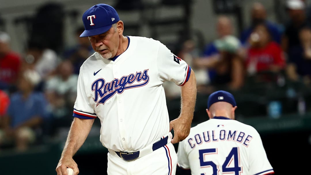 Aug 26, 2025; Arlington, Texas, USA; Texas Rangers manager Bruce Bochy (15) takes Texas Rangers relief pitcher Danny Coulombe (54) out of the game during the ninth inning against the Los Angeles Angels at Globe Life Field. 