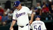Aug 26, 2025; Arlington, Texas, USA; Texas Rangers manager Bruce Bochy (15) takes Texas Rangers relief pitcher Danny Coulombe (54) out of the game during the ninth inning against the Los Angeles Angels at Globe Life Field. 