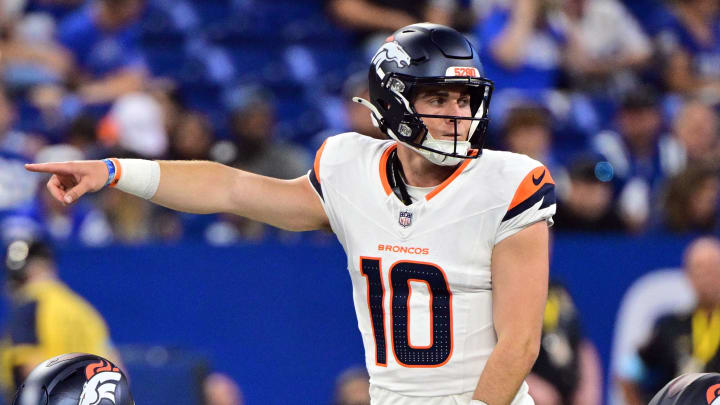 Aug 11, 2024; Indianapolis, Indiana, USA; Denver Broncos quarterback Bo Nix (10) points during the second quarter against the Indianapolis Colts at Lucas Oil Stadium. Mandatory Credit: Marc Lebryk-USA TODAY Sports