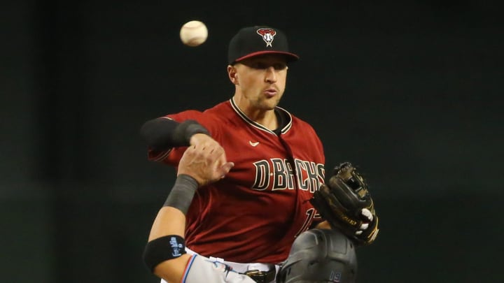 Arizona Diamondbacks shortstop Nick Ahmed (13) throws to first after forcing out Miami Marlins' Miguel Rojas (19) to start a double play during the ninth inning at Chase Field May 12, 2021.

Marlins Vs Diamondbacks