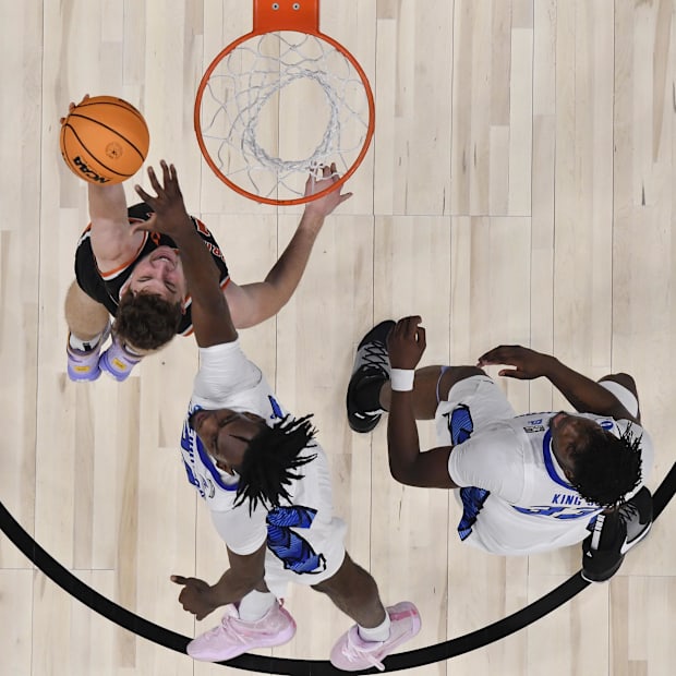 Pierce shoots against Creighton Bluejays forward Arthur Kaluma during a game last season.