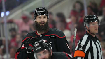 May 20, 2025; Raleigh, North Carolina, USA; Carolina Hurricanes defenseman Brent Burns (8) and forward Jordan Martinook (48) look on during the third period against the Florida Panthers in game one of the Eastern Conference Final of the 2025 Stanley Cup Playoffs at Lenovo Center. Mandatory Credit: James Guillory-Imagn Images