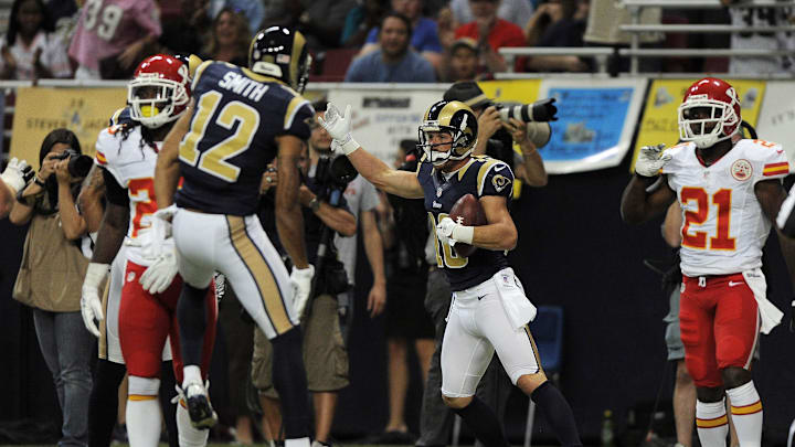 August 18, 2012; St. Louis, MO, USA; St. Louis Rams wide receiver Danny Amendola (16)  celebrates with wide receiver Steve Smith (12) after catching an 8 yard touchdown pass between his legs as Kansas City Chiefs cornerback Javier Arenas (21) looks on in the first half at the Edward Jones Dome. Mandatory Credit: Jeff Curry-Imagn Images