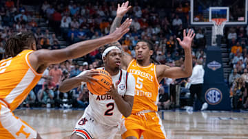 Auburn guard Denver Jones (2) drives the paint ahead of Tennessee guard Zakai Zeigler (5) during the first half of their semifinal game of the SEC Men's Basketball Tournament at Bridgestone Arena in Nashville, Tenn., Saturday, March 15, 2025.