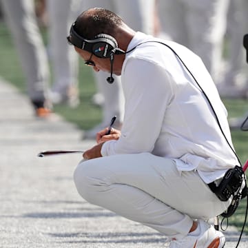 Sep 13, 2025; Austin, Texas, USA; Texas Longhorns head coach Steve Sarkisian takes notes during the first half against the Texas El Paso Miners at Darrell K Royal-Texas Memorial Stadium. Mandatory Credit: Scott Wachter-Imagn Images
