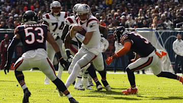 Patriots quarterback Drake Maye runs the ball against the Bears last season at Soldier Field.