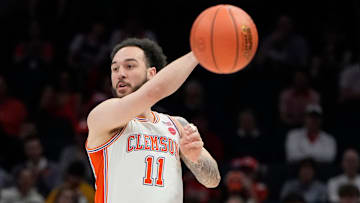 Mar 13, 2025; Charlotte, NC, USA; Clemson Tigers guard Jaeden Zackery (11) passes the ball in the first half at Spectrum Center. Mandatory Credit: Bob Donnan-Imagn Images
