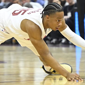 May 13, 2024; Cleveland, Ohio, USA; Cleveland Cavaliers forward Isaac Okoro (35) reaches for the ball against the Boston Celtics in the second quarter of game four of the second round for the 2024 NBA playoffs at Rocket Mortgage FieldHouse. Mandatory Credit: David Richard-Imagn Images