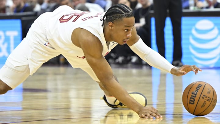 May 13, 2024; Cleveland, Ohio, USA; Cleveland Cavaliers forward Isaac Okoro (35) reaches for the ball against the Boston Celtics in the second quarter of game four of the second round for the 2024 NBA playoffs at Rocket Mortgage FieldHouse. Mandatory Credit: David Richard-Imagn Images