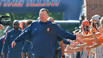 Aug 29, 2025; Champaign, Illinois, USA;  Illinois Fighting Illini head coach Bret Bielema leads his team during the Illini Walk before an NCAA football game against the Western Illinois Leathernecks at Memorial Stadium. Mandatory Credit: Ron Johnson-Imagn Images