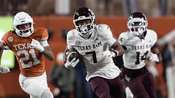 Texas A&M Aggies wide receiver KC Concepcion (7) returns a punt during the first half against the Texas Longhorns at Darrell K Royal-Texas Memorial Stadium. 