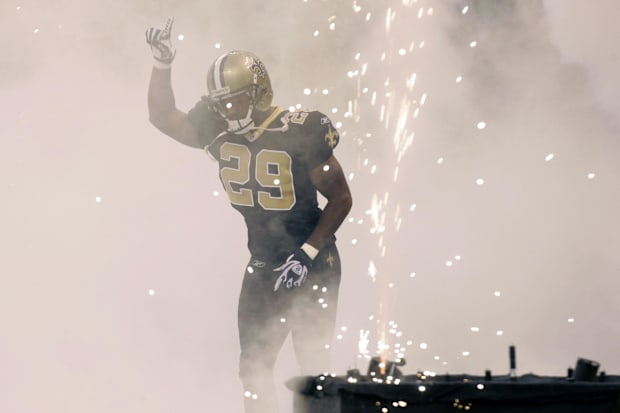 New Orleans Saints safety Josh Bullocks runs onto the field before the start of the game against the Carolina Panthers.