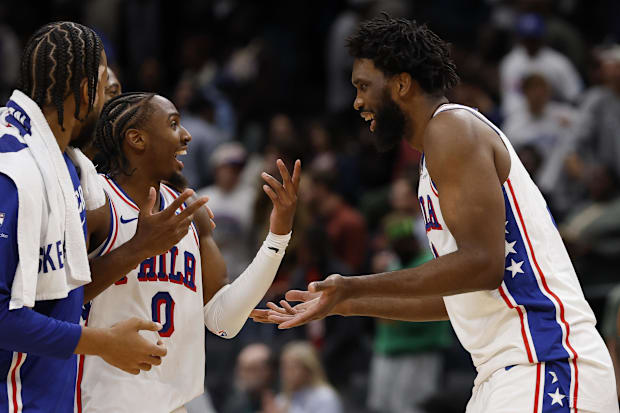 76ers guard Tyrese Maxey celebrates with center Joel Embiid against the Wizards.