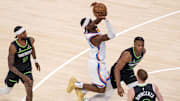May 20, 2025; Oklahoma City, Oklahoma, USA; Oklahoma City Thunder guard Shai Gilgeous-Alexander (2) shoots against Minnesota Timberwolves guard Jaylen Clark (22) in the first quarter during game one of the western conference finals for the 2025 NBA Playoffs at Paycom Center. Mandatory Credit: Brett Rojo-Imagn Images