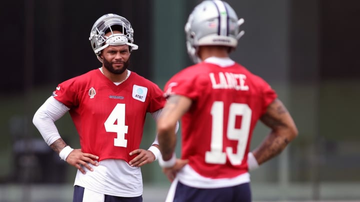 Jun 4, 2024; Frisco, TX, USA; Dallas Cowboys quarterback Dak Prescott (4) and quarterback Trey Lance (19) stand on the field during practice at the Ford Center at the Star Training Facility in Frisco, Texas. Mandatory Credit: Tim Heitman-USA TODAY Sports