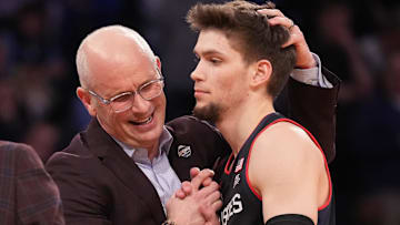 Mar 14, 2025; New York, NY, USA;  Connecticut Huskies head coach Dan Hurley with guard Aidan Mahaney (20) at a time out in the second half at Madison Square Garden. Mandatory Credit: Robert Deutsch-Imagn Images