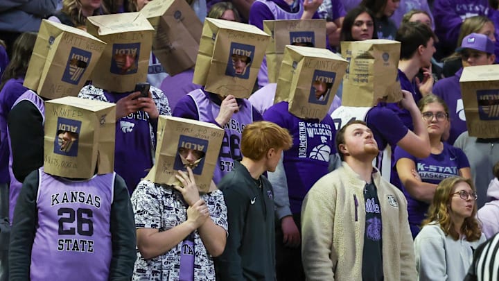 Feb 11, 2026; Manhattan, Kansas, USA; Kansas State Wildcats students wear grocery bags over their heads during the first half against he Cincinnati Bearcats at Bramlage Coliseum. 