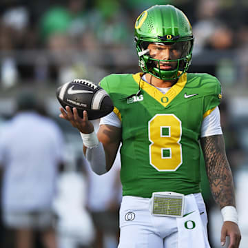 Sep 7, 2024; Eugene, Oregon, USA; Oregon Ducks quarterback Dillon Gabriel (8) warms up before a game against the Boise State Broncos at Autzen Stadium. Mandatory Credit: Troy Wayrynen-Imagn Images