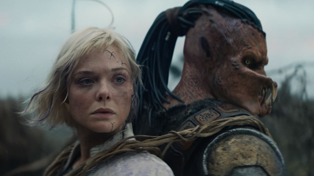 (L-R) Thia (Elle Fanning) and Dek (Dimitrius Schuster-Koloamatangi) in 20th Century Studios' PREDATOR: BADLANDS film