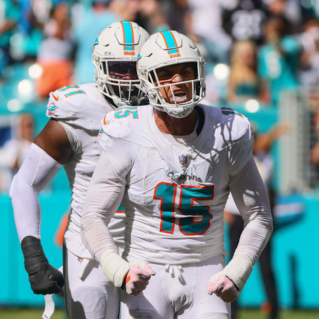Miami Dolphins EDGE Jaelan Phillips celebrates after sacking Jacksonville Jaguars quarterback Trevor Lawrence.
