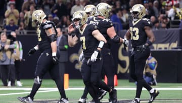 Dec 17, 2023; New Orleans, Louisiana, USA; New Orleans Saints tight end Juwan Johnson (83) is congratulated after a touchdown against the New York Giants during the second half at Caesars Superdome. Mandatory Credit: Stephen Lew-USA TODAY Sports