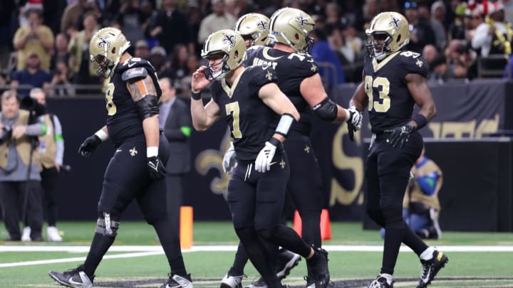 Dec 17, 2023; New Orleans, Louisiana, USA; New Orleans Saints tight end Juwan Johnson (83) is congratulated after a touchdown against the New York Giants during the second half at Caesars Superdome. Mandatory Credit: Stephen Lew-USA TODAY Sports