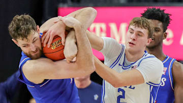 Vegas Showdown: Kansas v Duke; Duke basketball forward Cooper Flagg battles Kansas center Hunter Dickinson for a loose ball