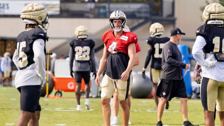 Aug 1, 2023; Metairie, LA, USA;  New Orleans Saints quarterback Derek Carr (4) looks on during  training camp at the Ochsner Sports Performance Center. Mandatory Credit: Stephen Lew-USA TODAY Sports