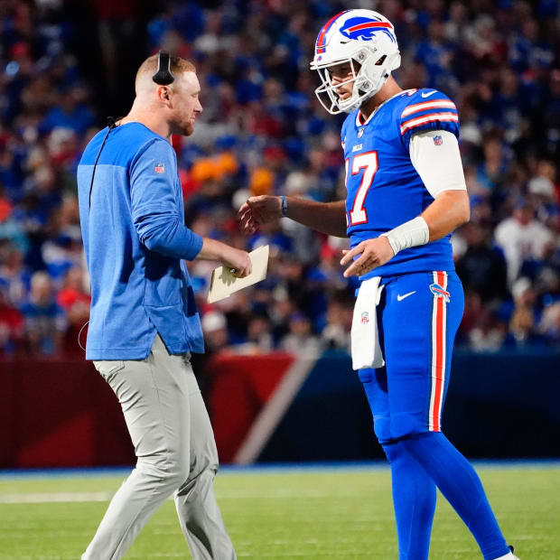 Buffalo Bills quarterbacks coach Joe Brady speaks with Buffalo Bills quarterback Josh Allen