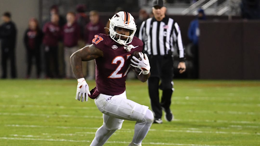Oct 24, 2025; Blacksburg, Virginia, USA;  Virginia Tech Hokies running back Marcellous Hawkins (27) runs the ball against the California Golden Bears during the first quarter at Lane Stadium. Mandatory Credit: Brian Bishop-Imagn Images