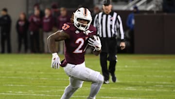 Oct 24, 2025; Blacksburg, Virginia, USA;  Virginia Tech Hokies running back Marcellous Hawkins (27) runs the ball against the California Golden Bears during the first quarter at Lane Stadium. Mandatory Credit: Brian Bishop-Imagn Images