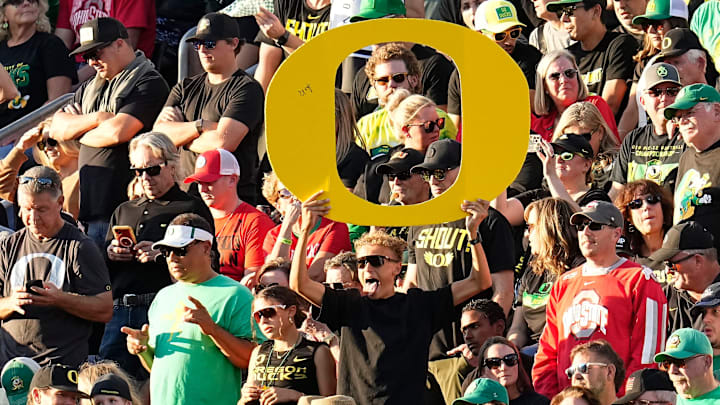 Oct 12, 2024; Eugene, Oregon, USA; Oregon Ducks fans cheer on a touchdown by Oregon Ducks wide receiver Evan Stewart (7) during the first half of the NCAA football game against the Ohio State Buckeyes at Autzen Stadium
