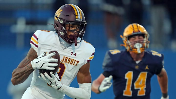 Walsh Jesuit wide receiver scores a touchdown ahead of Saint Ignatius defensive back during the first half of a high school football game at Don Shula Stadium, Sept. 12, 2025, in University Heights, Ohio.