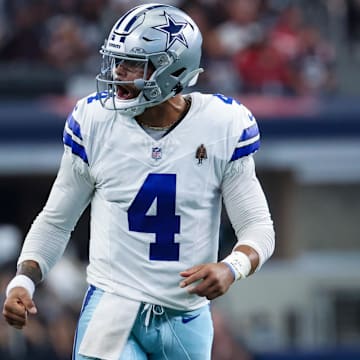 Dallas Cowboys quarterback Dak Prescott reacts after throwing a touchdown pass during against the Patriots.