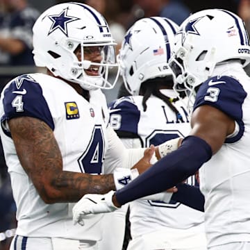 Dallas Cowboys QB Dak Prescott and WR George Pickens celebrate after a touchdown against the Washington Commanders.