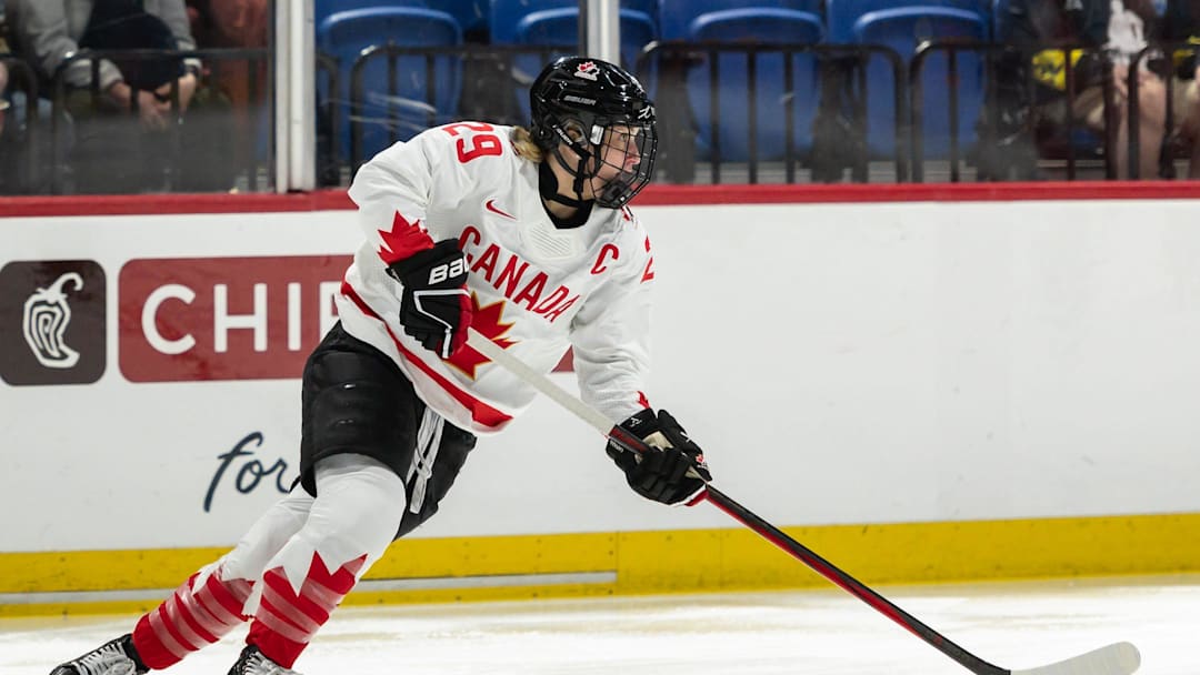 Canada's Marie-Philip Poulin looks for a pass at the Adirondack Bank Center in Utica, N.Y. on April 5, 2024.